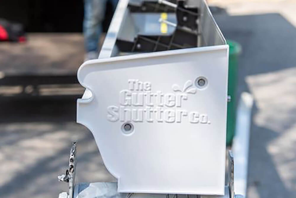 The Gutter Shutter Co. franchise business branding on a gutter