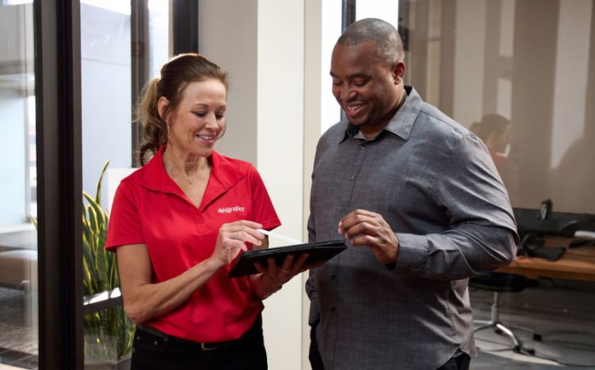 ALPHA GRAPHICS STAFFER WITH CUSTOMER