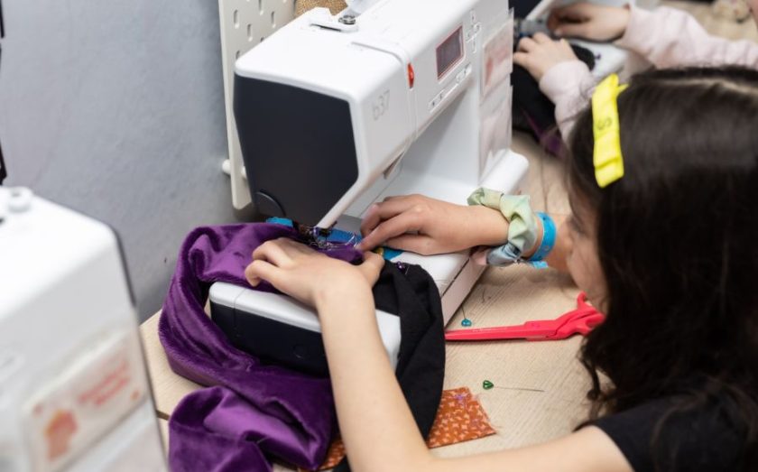 Child sewing at The Fashion Class franchise